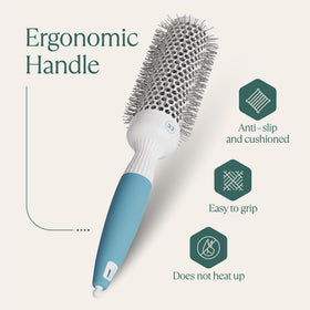 Osensia round brush on a vanity with styling tools