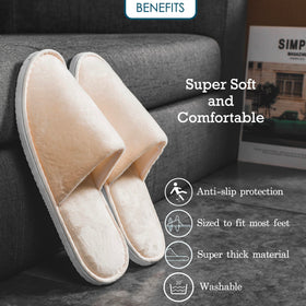 OSTADARRA Spa Slippers displayed in a hotel room setting