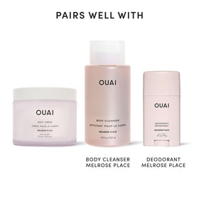 OUAI Body Cream Travel Size with floral background