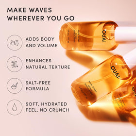 OUAI Wave Spray lifestyle scene on a beach
