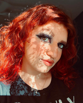 oVertone Poppy Orange Hair Mask in a shower setting