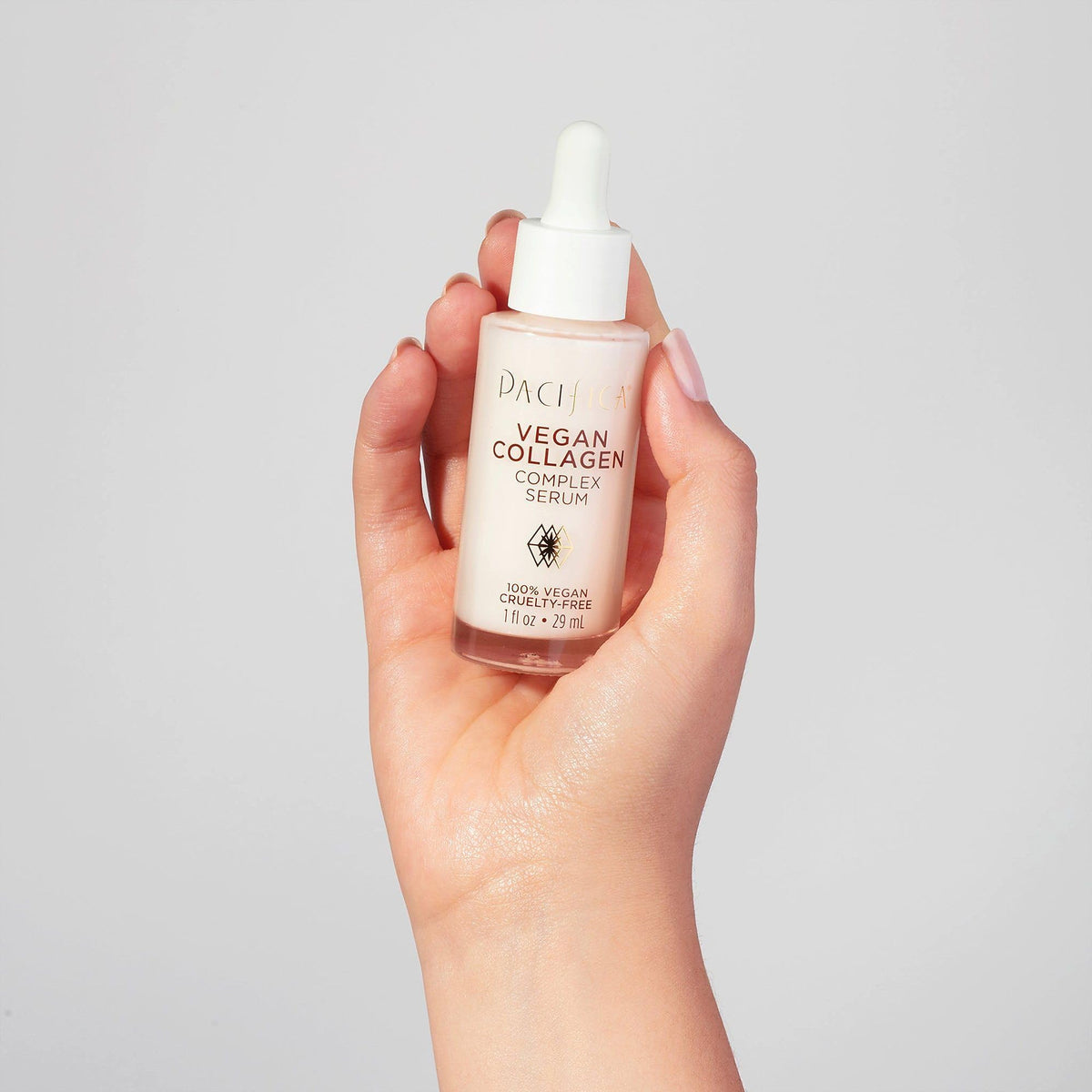 Pacifica Vegan Collagen Complex Serum with floral ingredients background