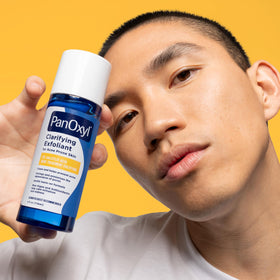 PanOxyl Clarifying Exfoliant 2% Salicylic Acid in bathroom setting