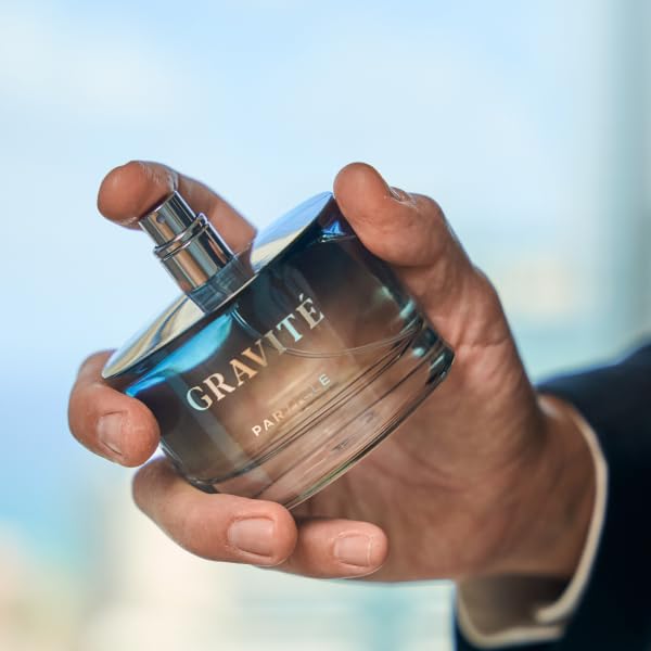 Particle Gravité Cologne Spray bottle with woody background