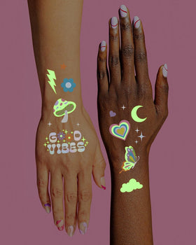 Party scene featuring guests applying glow in the dark tattoos