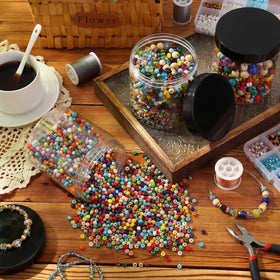 Patelai 16 Ounce jar with various craft supplies