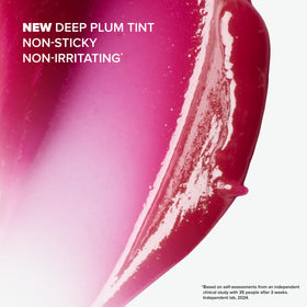 Paula's Choice Pro-Collagen Peptide Gloss Lip Balm Deep Plum on a vanity