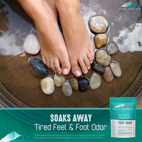 Person soaking feet in a basin with Purely Northwest Foot Soak