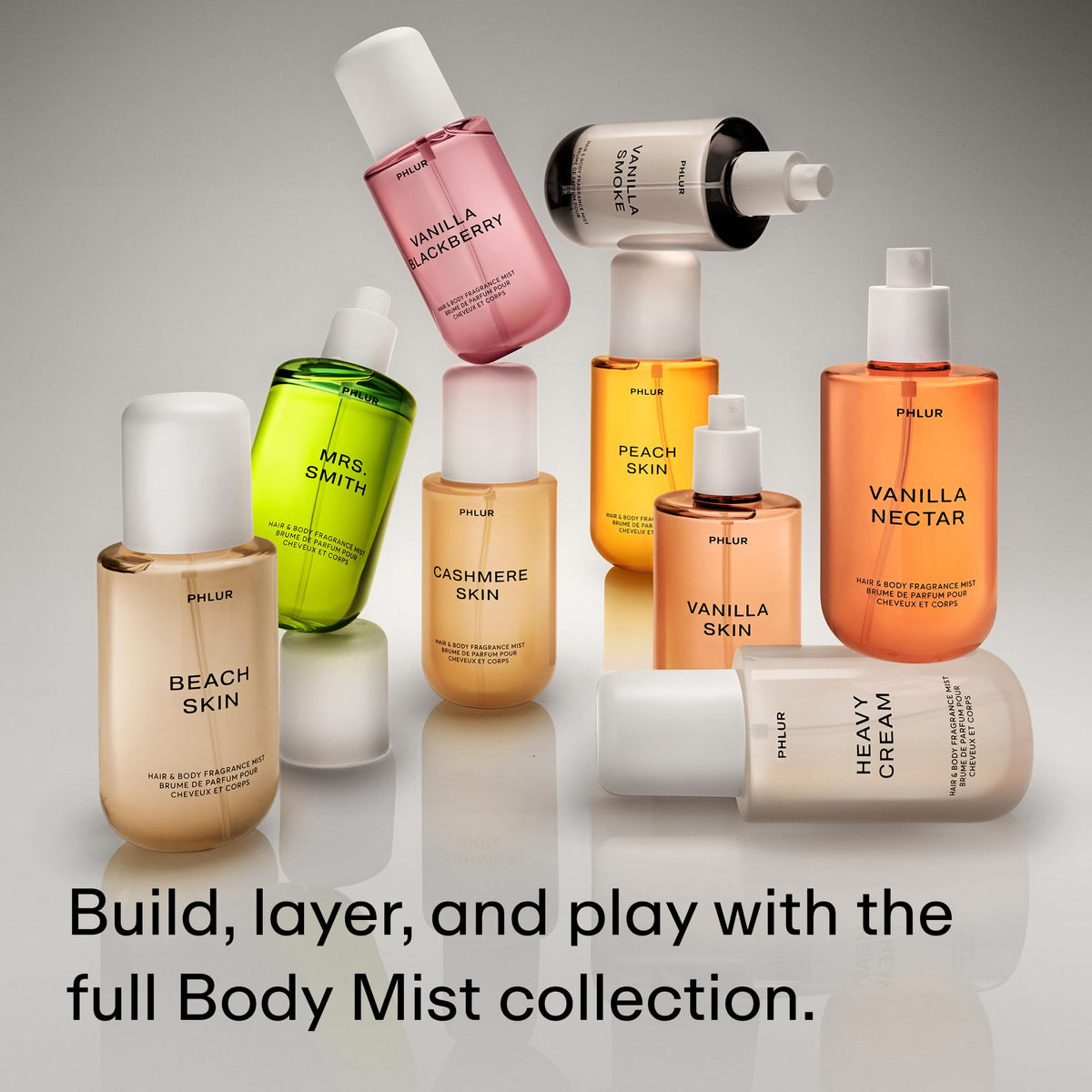 PHLUR Beach Skin Body Mist on a vanity table