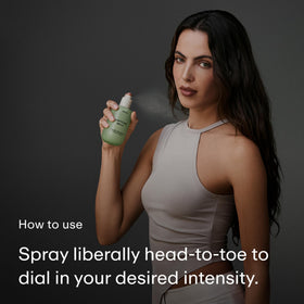 PHLUR Matcha Milk Body Mist on a vanity with greenery