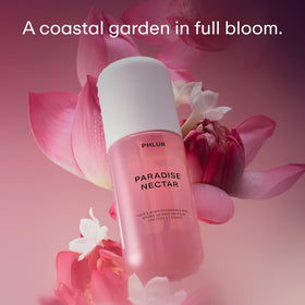 PHLUR Paradise Nectar Body Mist bottle with floral background
