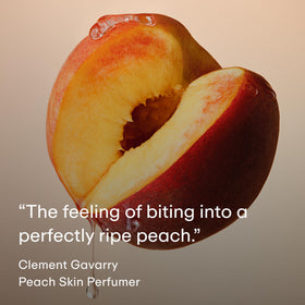 PHLUR Peach Skin Body Mist bottle on a vanity