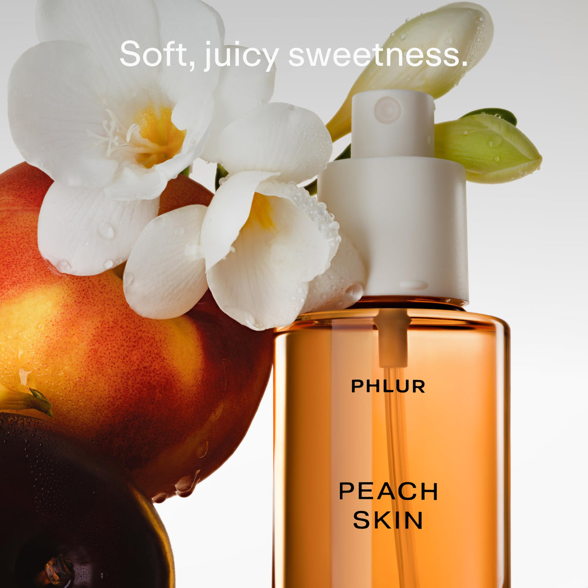 PHLUR Peach Skin Body Mist bottle with peach and floral background