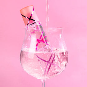 Pink Sugar Eau de Toilette packaging next to a sweet