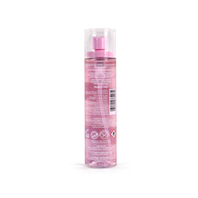 Pink Sugar Hair Perfume bottle with cotton candy background