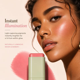 Pixi ON-THE-GLOW Cream Blush Stick on a makeup table