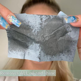 PleasingCare Large Face Oil Blotting Sheets being pulled from dispenser