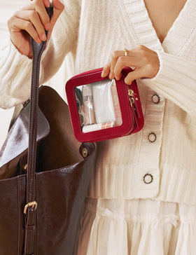 Popvibe Small Clear Makeup Bag on a travel bag