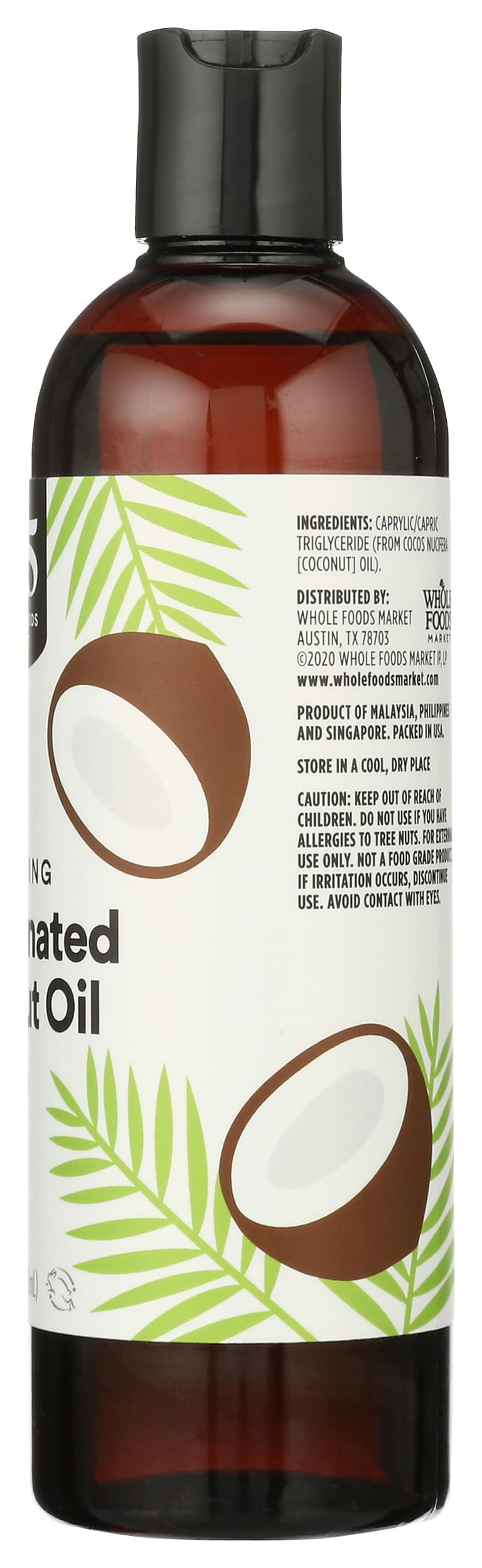 Pouring 365 by Whole Foods Market Moisturizing Fractionated Coconut Oil into hands