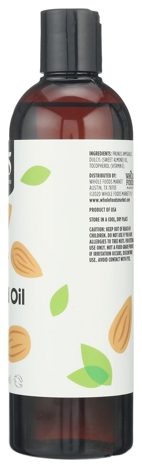 Pouring 365 Sweet Almond Oil into a hand