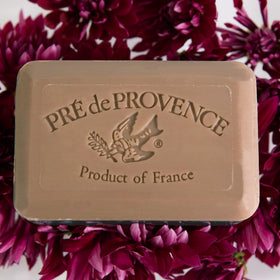 Pre de Provence Patchouli Soap Bar with floral background