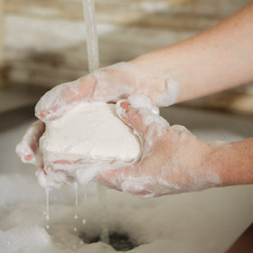 Pre de Provence soap bar cut in half to show lather