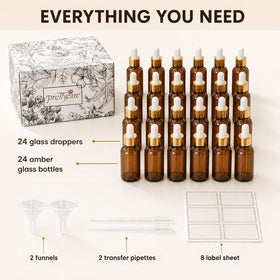 PrettyCare dropper bottles with accessories on a wooden surface