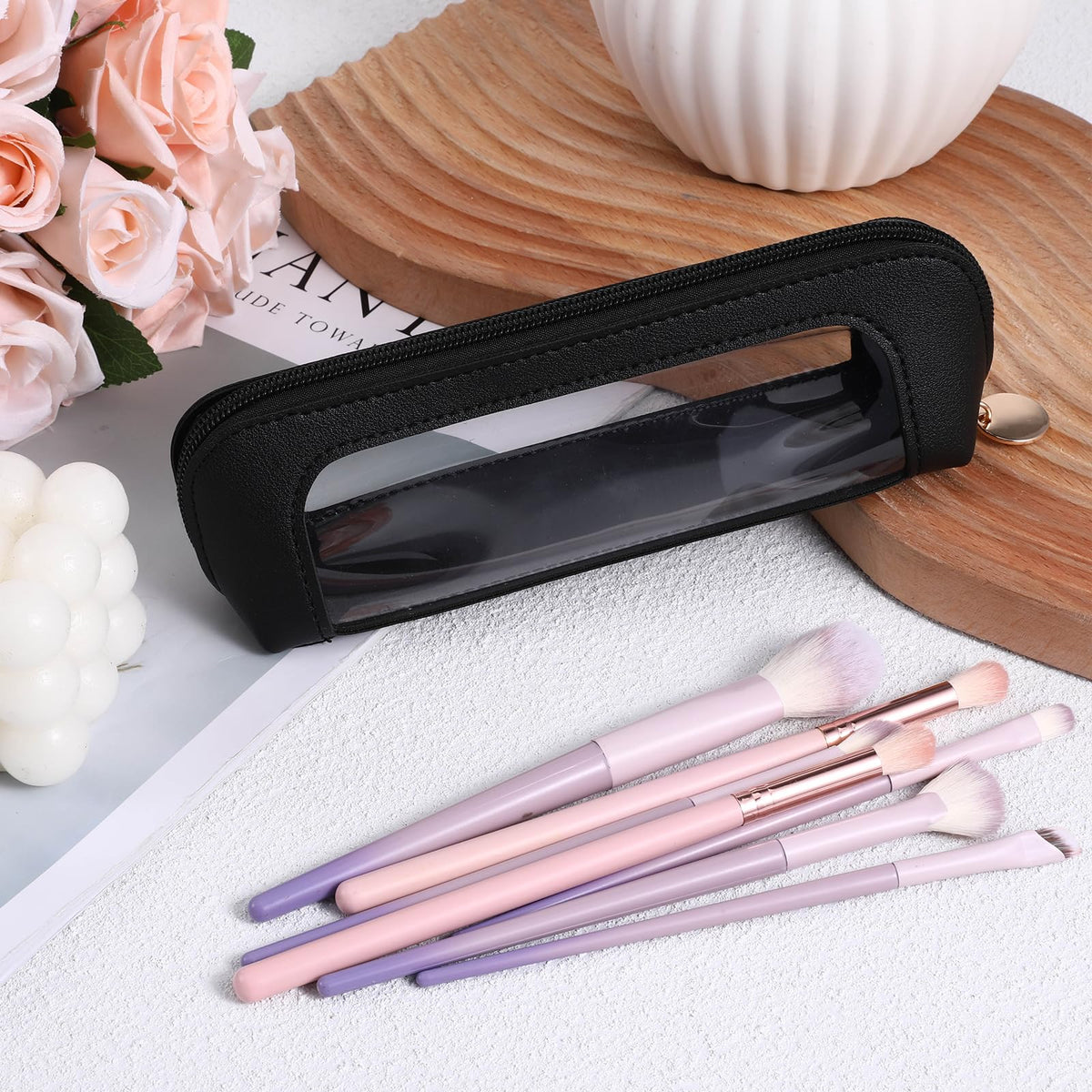 Psyqtsuary Clear Makeup Bag lifestyle scene with travel items