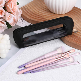 Psyqtsuary Clear Makeup Bag lifestyle scene with travel items