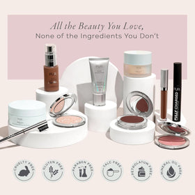 PÜR MINERALS 4-in-1 Tinted Moisturizer on vanity with makeup tools