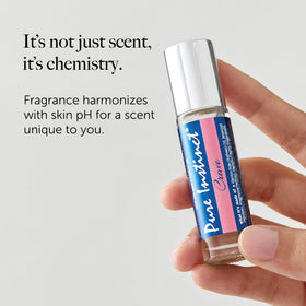 Pure Instinct pheromone cologne bottle against a soft background