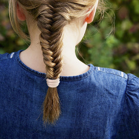 Qarwayoc hair ties showing their stretch and durability