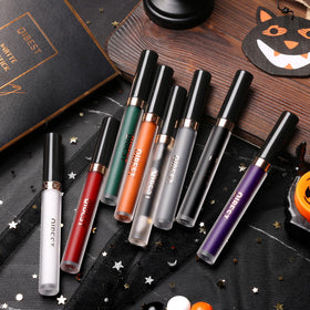 QiBest lipsticks displayed with Halloween makeup accessories