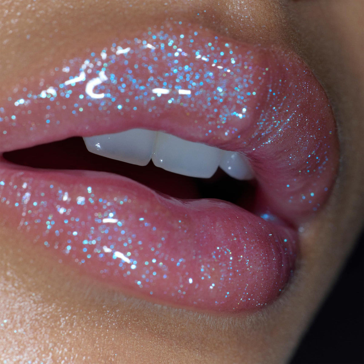 r.e.m. beauty Fembot Essential Drip Glossy Balm on lips