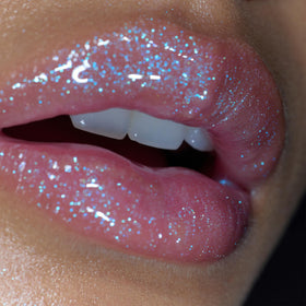 r.e.m. beauty Fembot Essential Drip Glossy Balm on lips