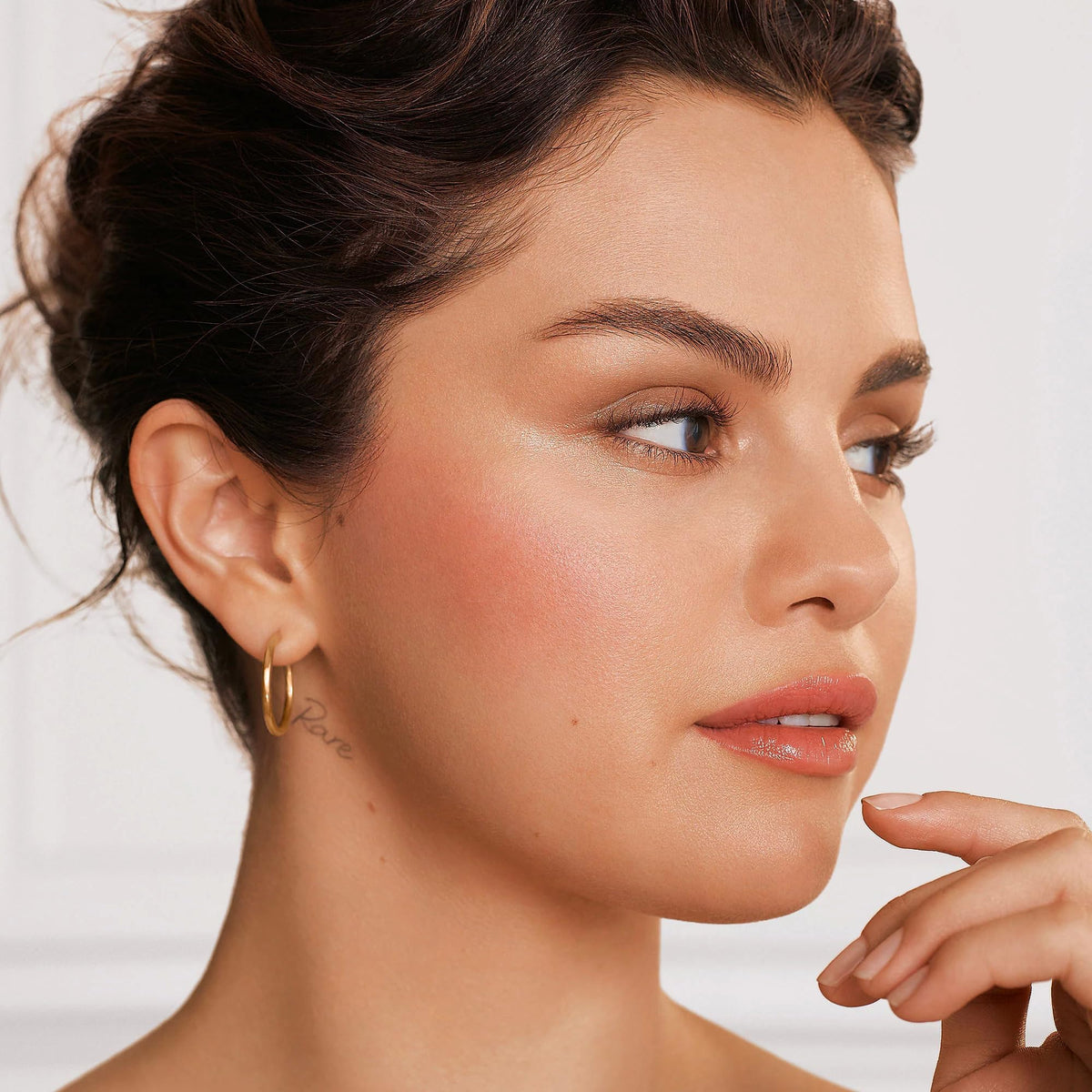 Rare Beauty Positive Light Liquid Luminizer Enchant swatch on skin