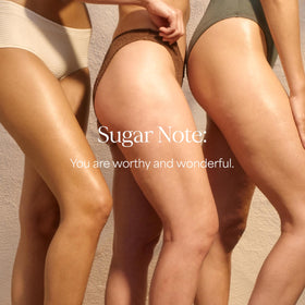 RAW SUGAR Caramel Vanilla Delight Body Wash on a shower shelf