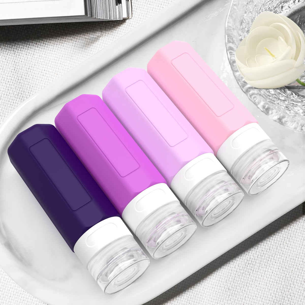 Redfly travel bottles filled with shampoo and conditioner