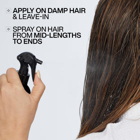 Redken Acidic Color Gloss Leave-In Spray in use on hair