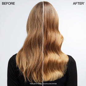 Redken Acidic Color Gloss Leave-In Spray on a bathroom counter