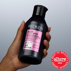Redken Acidic Color Gloss Shampoo in bathroom setting
