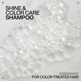 Redken Acidic Color Gloss Shampoo on a vanity table