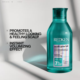 Redken Acidic Grow Full Densifying Shampoo 1.7 Fl Oz in bathroom setting