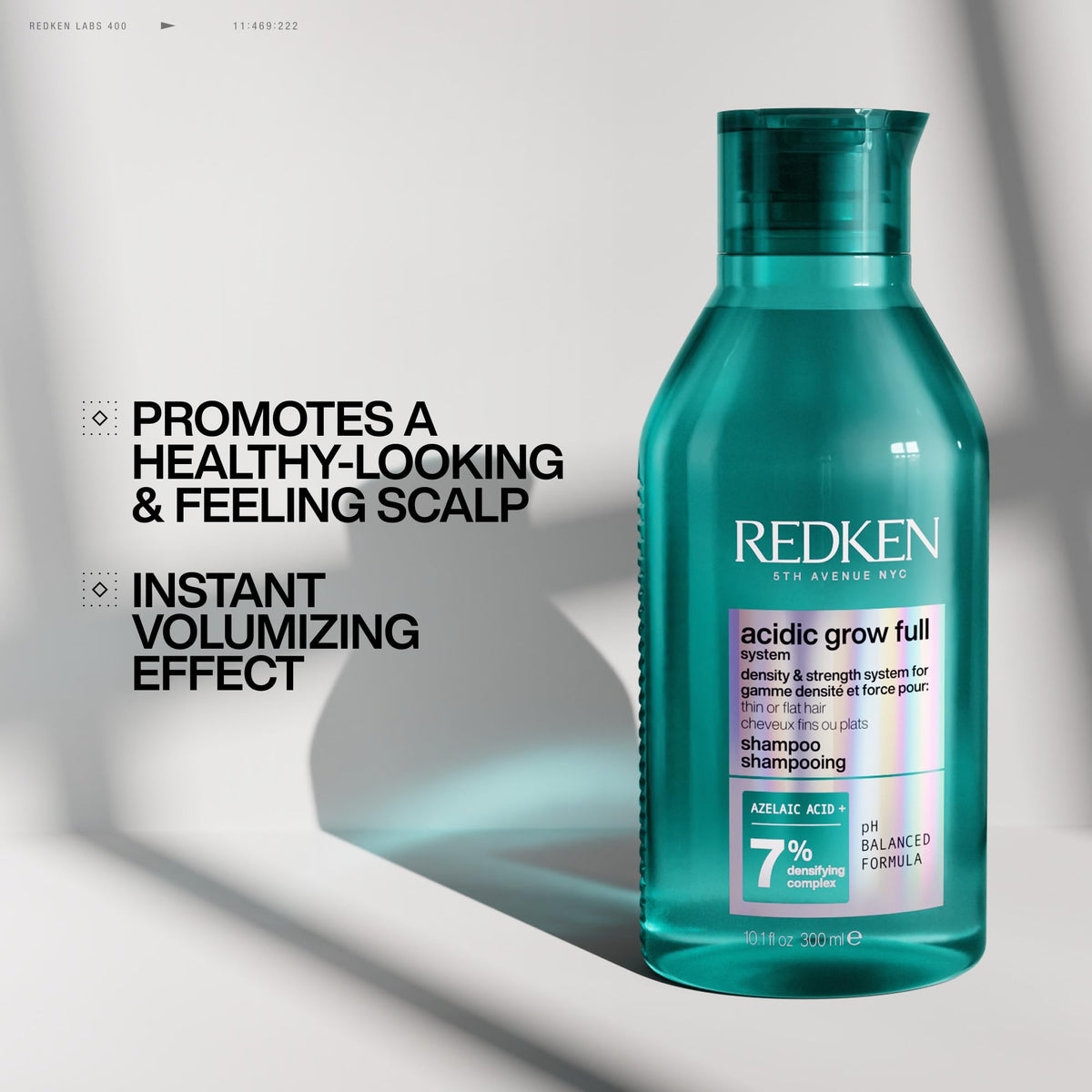 Redken Acidic Grow Full Densifying Shampoo in a bathroom setting