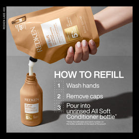 Redken All Soft Conditioner 495g showing texture on hand