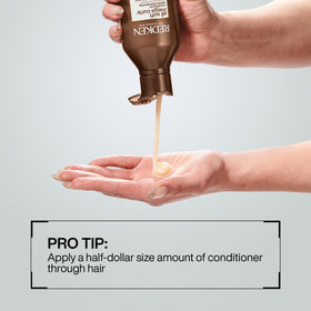 Redken All Soft Mega Curls Conditioner in bathroom setting