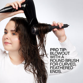 Redken Big Blowout Heat Protectant Gel lifestyle scene with blow dryer