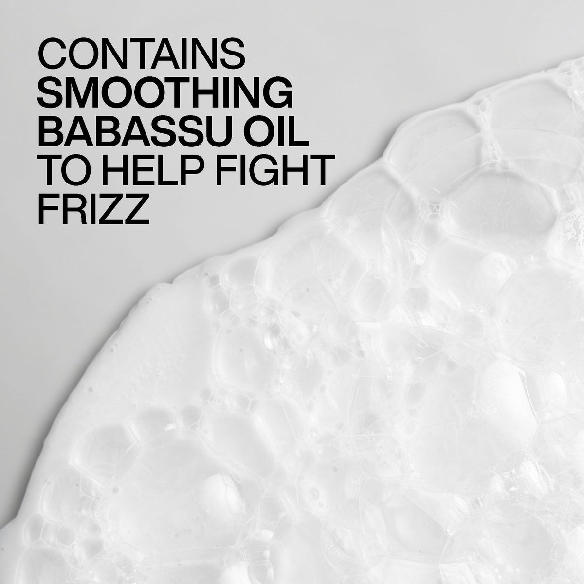 Redken Frizz Dismiss Shampoo in a bathroom setting