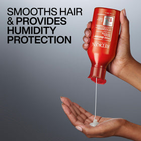 Redken Frizz Dismiss Shampoo lathering on hair