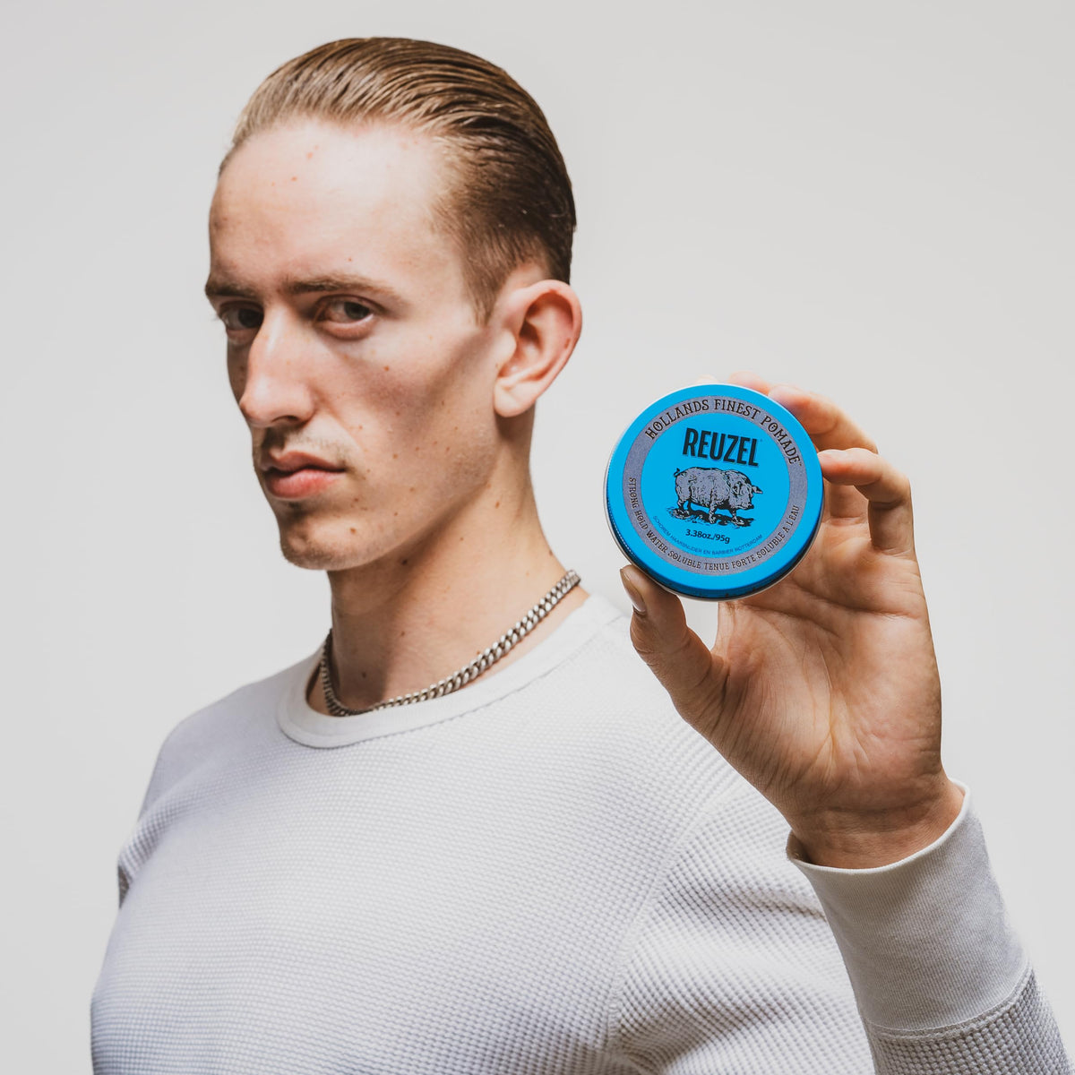 REUZEL Blue Pomade lid open showing product